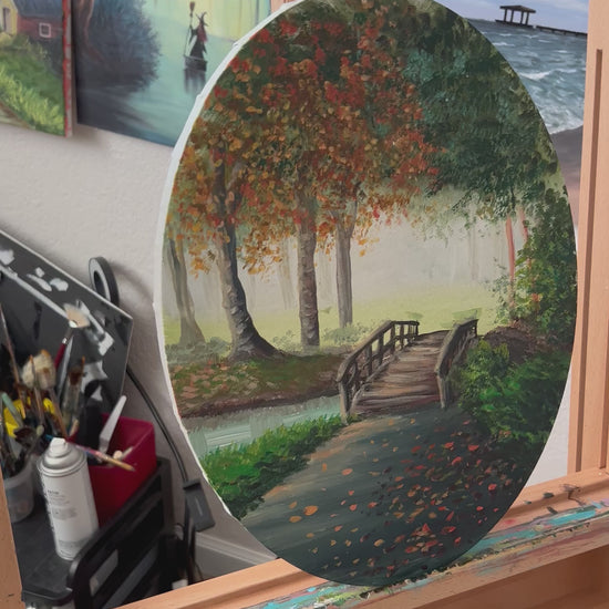 Autumn landscape painting on an oval canvas