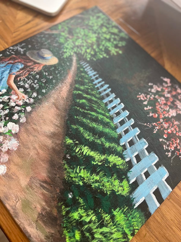 A woman in flowers and roses fields